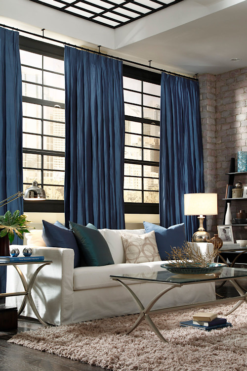 blue drapes in living room behind couch